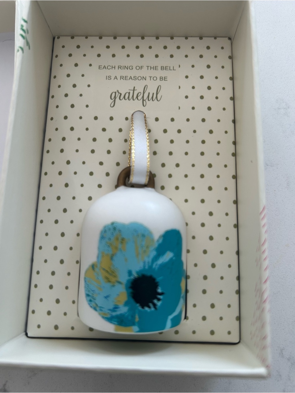 White Ceramic Bell Ornament with Teal Floral Accent and Gold Ribbon